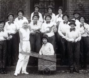 Nurses dressed up with hats, bow ties and ukuleles
