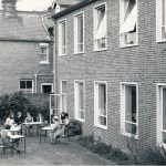 Nurses sitting outside Harcourt House