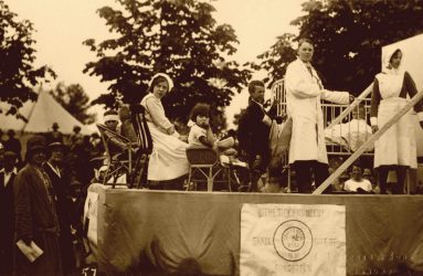 Float with cot on the back, children dressed as patients, doctor or nurses