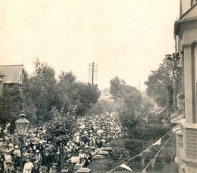 People dressed in ‘Sunday best’, women with long skirts and all with hats