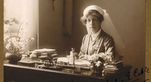 Adeline sat at writing desk