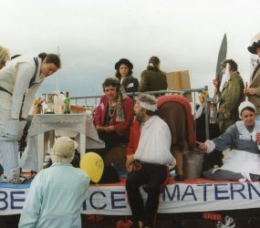 Staff dressed up as famous women on the back of the float