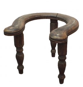 Three legged stool with horseshoe shaped top