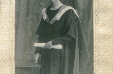 Dr Walker in graduation gown and mortar board