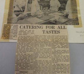 photo showing catering staff alongside new conveyer belt with article