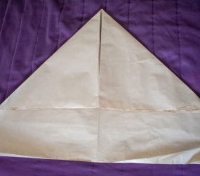 fold top corners to middle to make a triangle