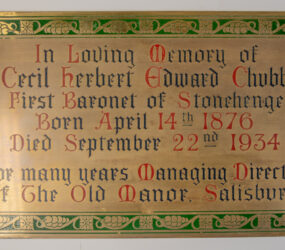 Brass plaque decorated with vine leaves commemorating Cecil Chubb in 1934