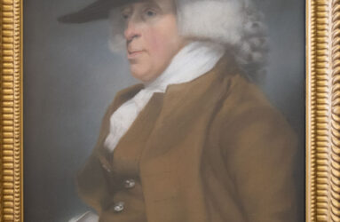 Pastel portrait in gold frame of man in powdered wig and brown coat