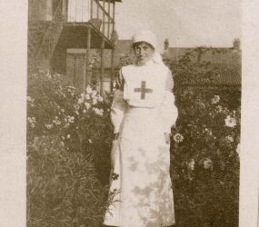 Nurse in uniform standing in the garden