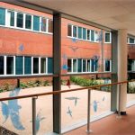 Printed silhouettes of birds on corridor glass