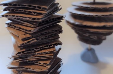stack of small corrugated card squares on a stick