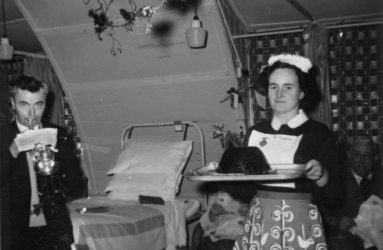 Sister Haines carries the Christmas pudding