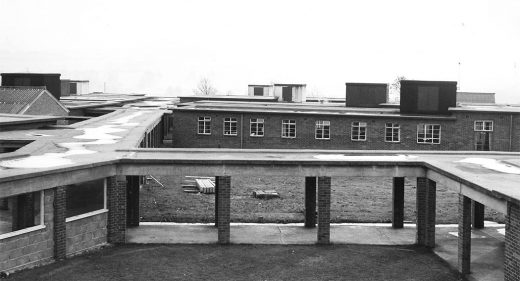 Walkway roof supported on brick pillars