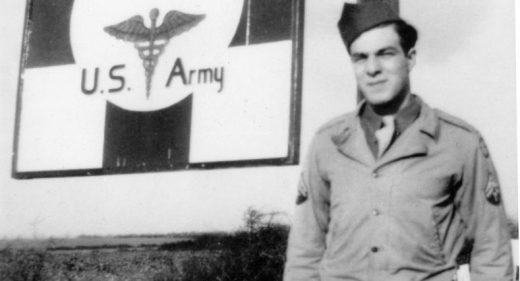 Soldier posing by the hospital sign