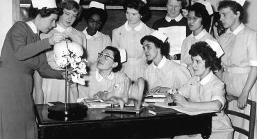 Sister showing group of nurses jawbone on skull