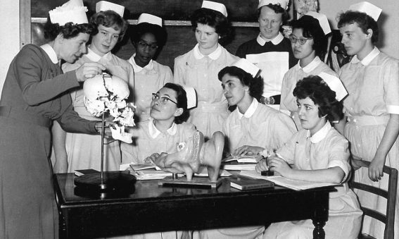Sister showing group of nurses jawbone on skull