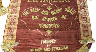 cloth banner with hospital motto 'the sick and needy shall not always be forgotten'