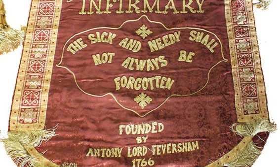 cloth banner with hospital motto 'the sick and needy shall not always be forgotten'
