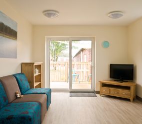 Lounge with sofa and TV
