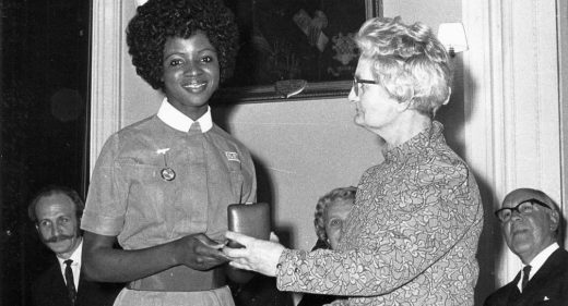 Nurse being presented with an award in a box
