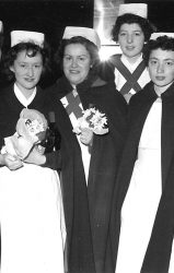 nurses in capes and white hats
