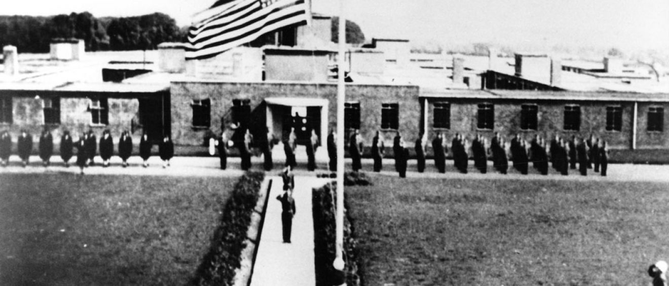 US army on parade with flag flying