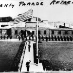 US army on parade with flag flying