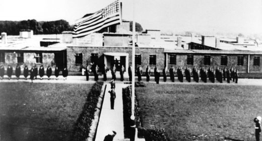 US army on parade with flag flying