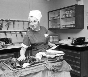 Theatre staff with equipment tray