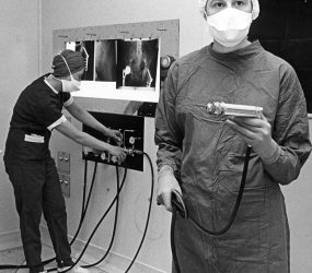 Theatre staff demonstrating new equipment
