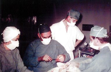 Surgeons carry out operation on patient