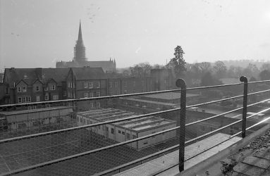 View across SGI rooftops, with cathedral spire in background