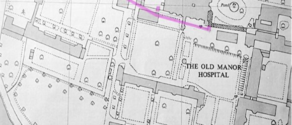 Black and white photo of map showing route of tunnel in pink