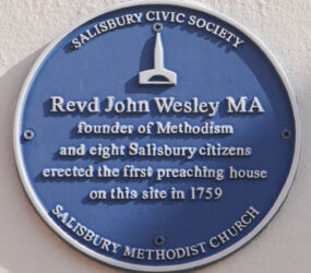 Photograph of blue plaque on wall for John Wesley