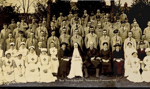 Soldiers and Red Cross nurses in a group photograph